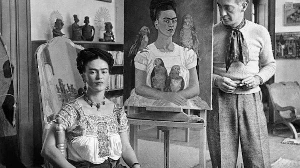 Nickolas Muray Frida Painting Me and My Parrots with Muray 1939 © The estate of the artist and PDNB Gallery